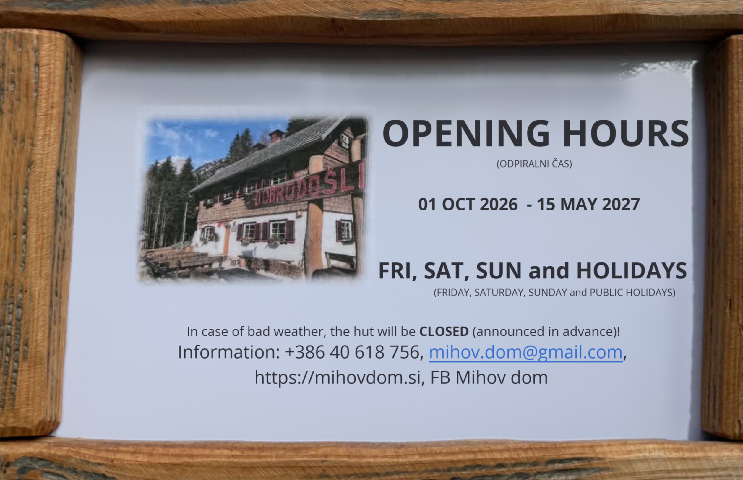 Mihov dom opening hours, winter 2026/27 Wooden-framed sign with Mihov dom opening hours: from 1 October 2026 to 15 May 2027, open on Fridays, Saturdays, Sundays and public holidays. In bad weather the hut is closed, announced in advance. Information: +386 40 618 756, mihov.dom@gmail.com, mihovdom.si.